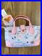 2025_Walt_Disney_World_Parks_Pink_Stoney_Clover_Lane_Pouchette_Crossbody_Actual_01_dpzw
